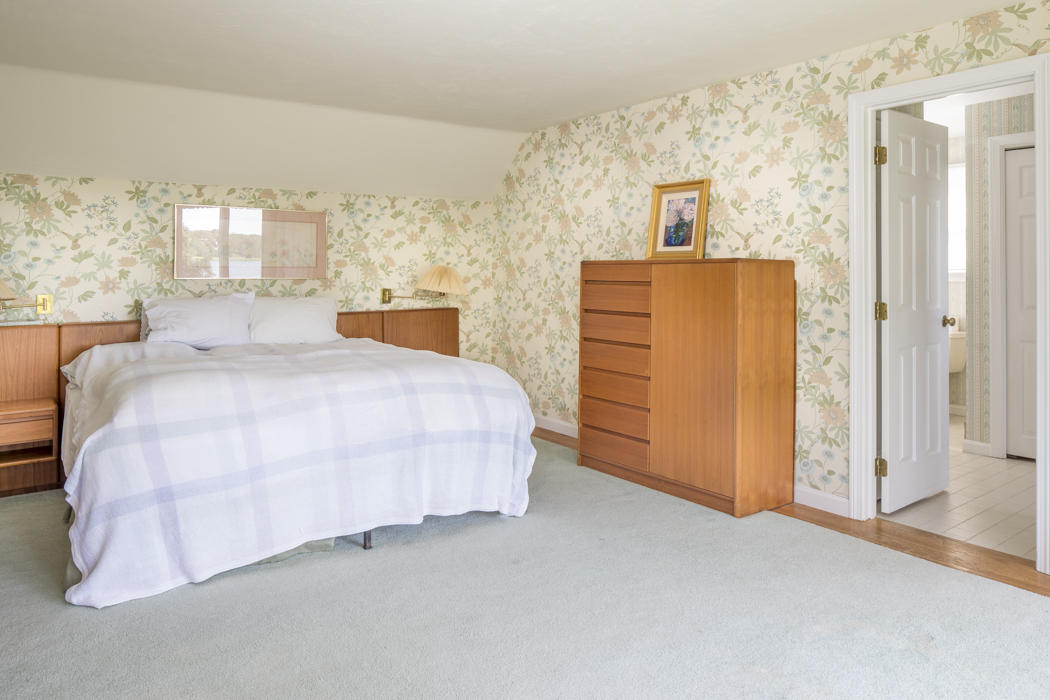 22 Jack Knife Point Road Orleans, MA 02653 - Photo 32 of 37 a bedroom with a bed and a cabinets