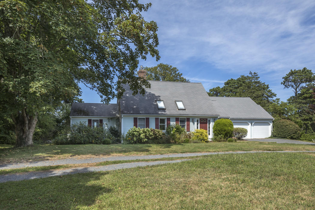 22 Jack Knife Point Road Orleans, MA 02653 - Photo 6 of 37 a front view of a house with a yard