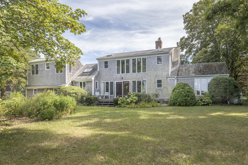 22 Jack Knife Point Road Orleans, MA 02653 - Photo 9 of 37 a front view of a house with a yard