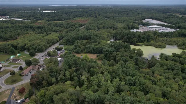 an aerial view of residential house with outdoor space and river
