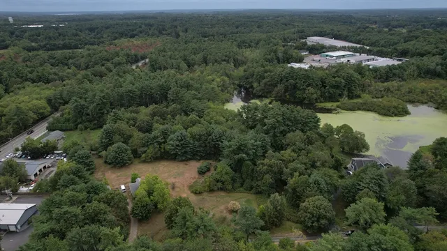 an aerial view of a town with trees