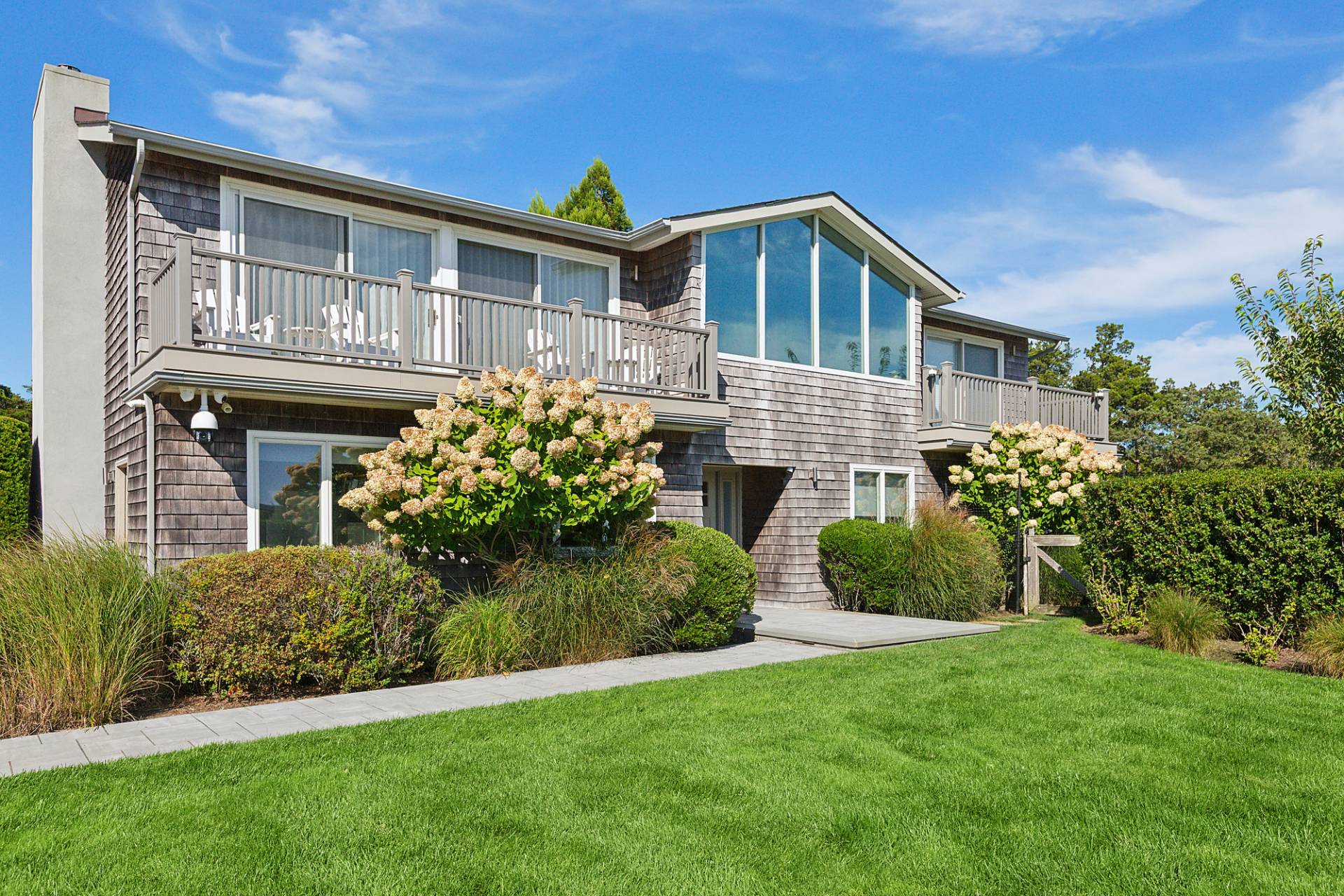 4 Bayberry Lane Remsenburg, NY 11960 - Photo 3 of 29 a front view of a house with a garden