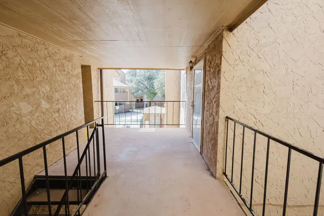 a view of hallway with furniture
