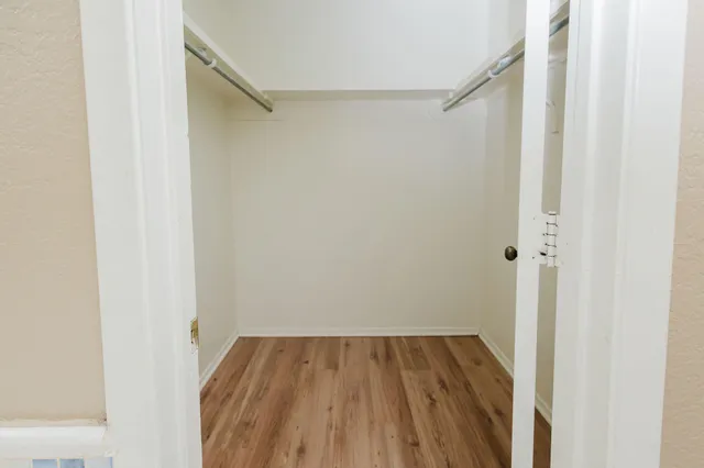 a view of a room with wooden floor and small staircase