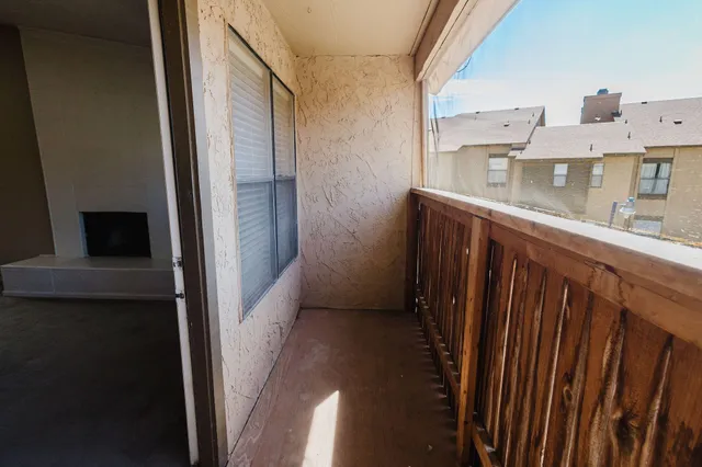 a view of balcony and front door