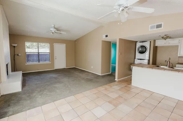 a view of a kitchen with cabinet a sink and a window