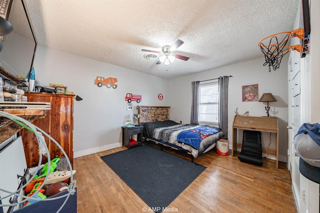 1309 Hudson Road Stamford, TX 79553 - Photo 20 of 35 a living room with furniture and a fireplace