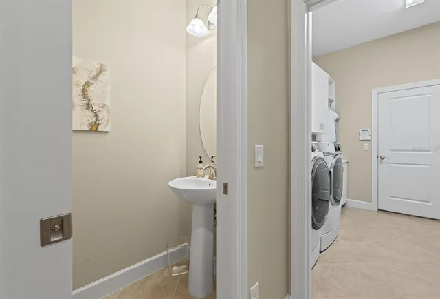 a bathroom with a sink and mirror