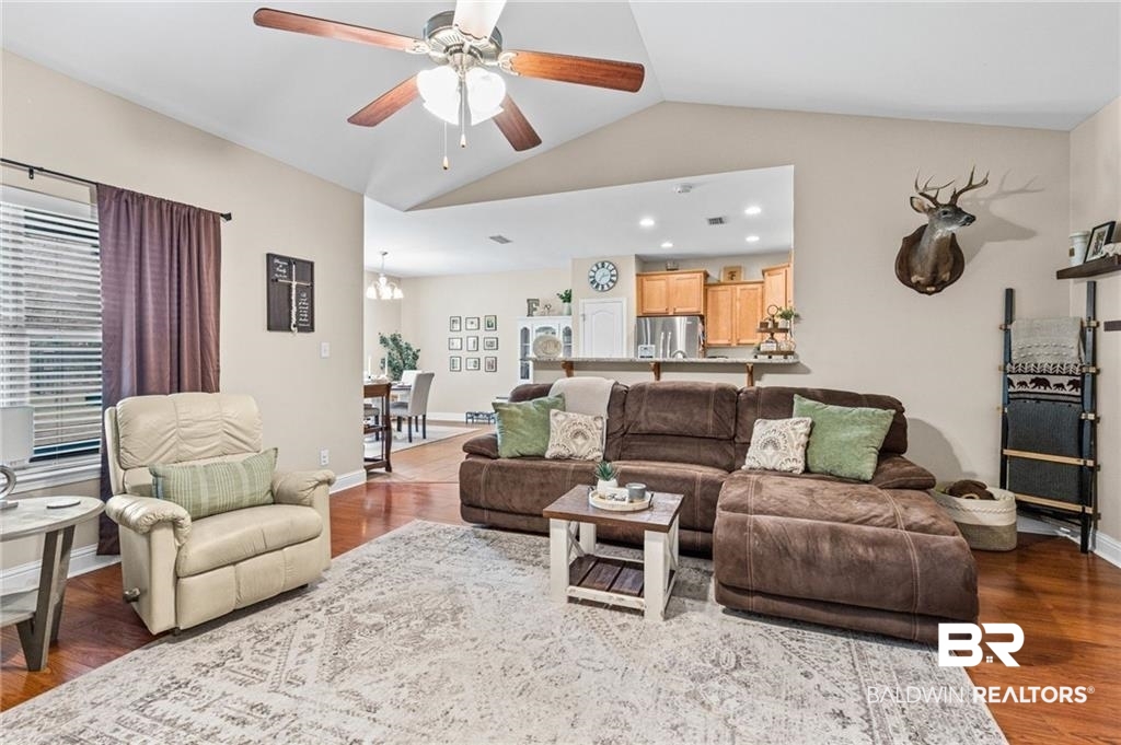 2570 Pecan Pointe Drive Semmes, AL 36575 - Photo 4 of 22 Living area featuring wood finished floors, ceiling fan, and recessed lighting