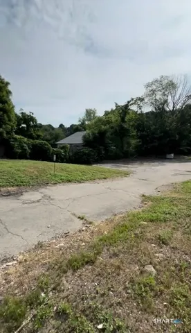 a view of a field with an ocean