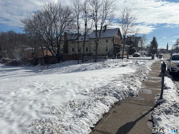 a view of snow on the side of road