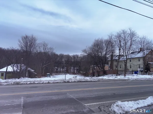 a view of street with snow on the side of the road