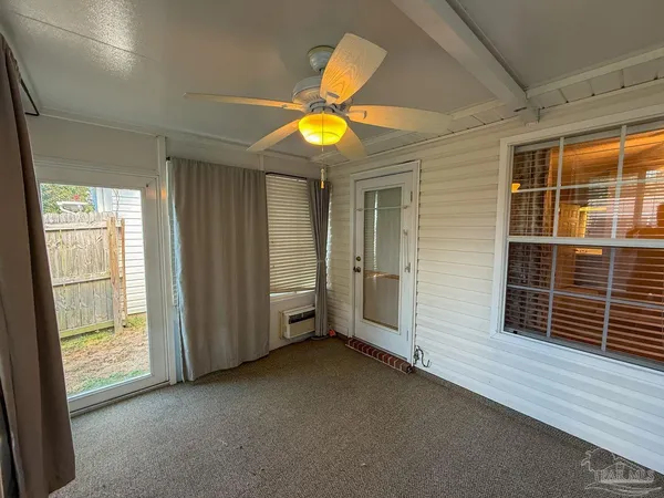a view of an empty room with a window