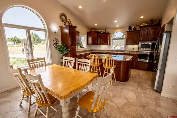 a kitchen with granite countertop a stove and cabinets