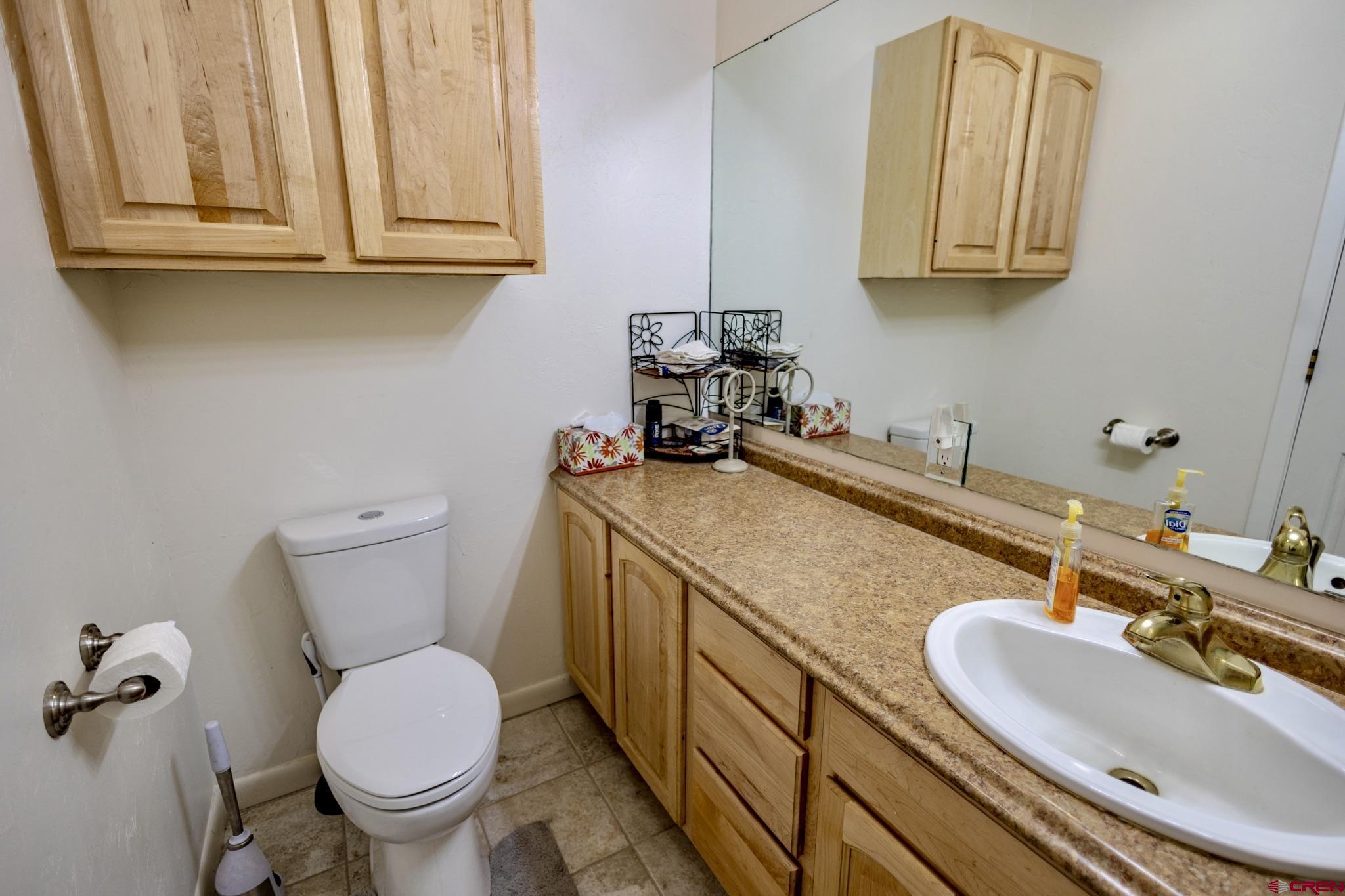 1253 3350th Road Crawford, CO 81415 - Photo 17 of 41 a bathroom with a sink and a toilet