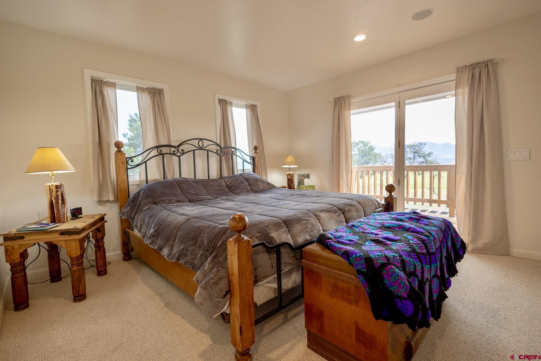 1253 3350th Road Crawford, CO 81415 - Photo 19 of 41 a bedroom with a bed and a window