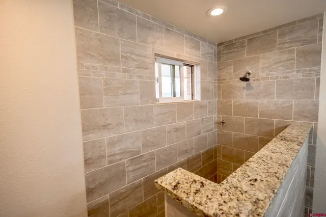 a bathroom with a toilet a sink and a shower