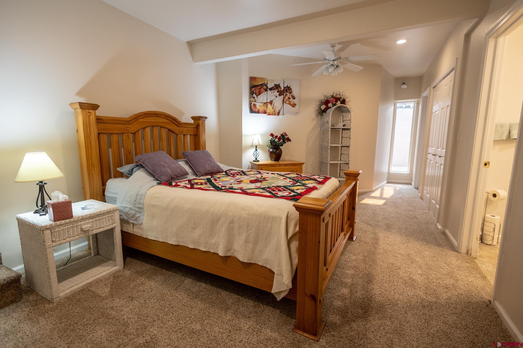 1253 3350th Road Crawford, CO 81415 - Photo 23 of 41 a bedroom with a bed and a cabinets