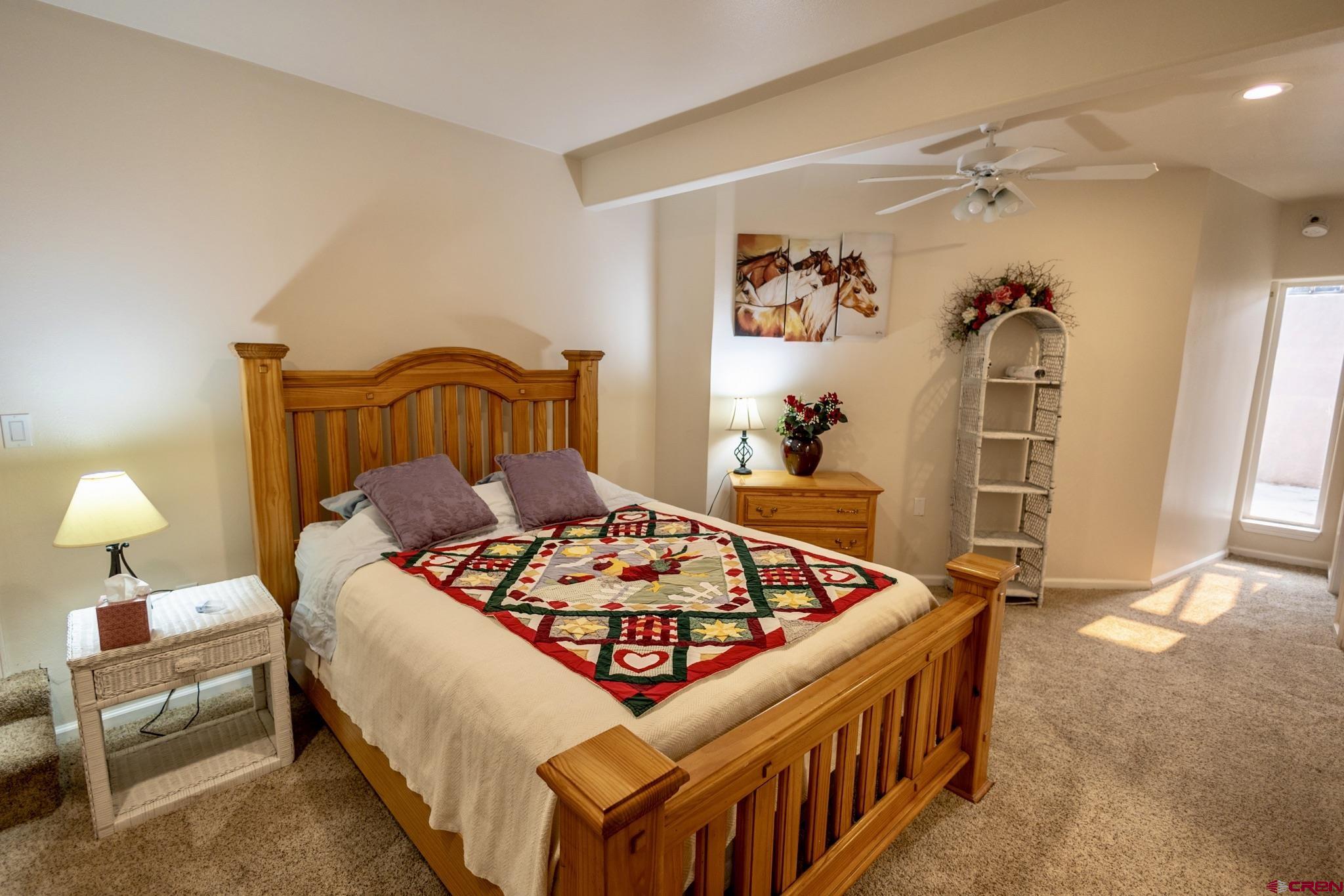 1253 3350th Road Crawford, CO 81415 - Photo 24 of 41 a bedroom with bed and a window