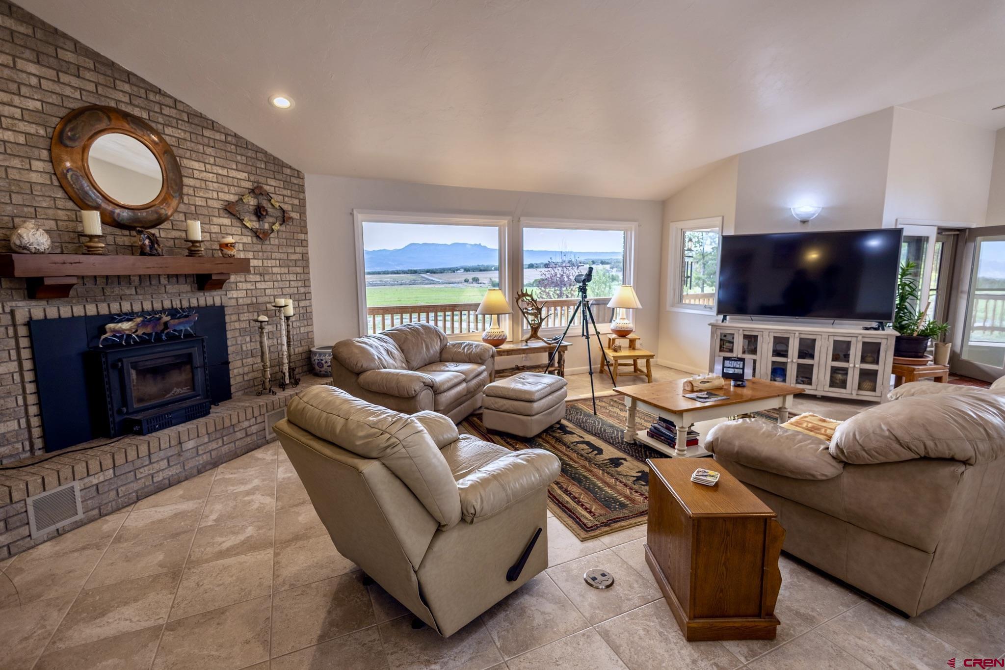 1253 3350th Road Crawford, CO 81415 - Photo 30 of 41 a living room with furniture and a flat screen tv