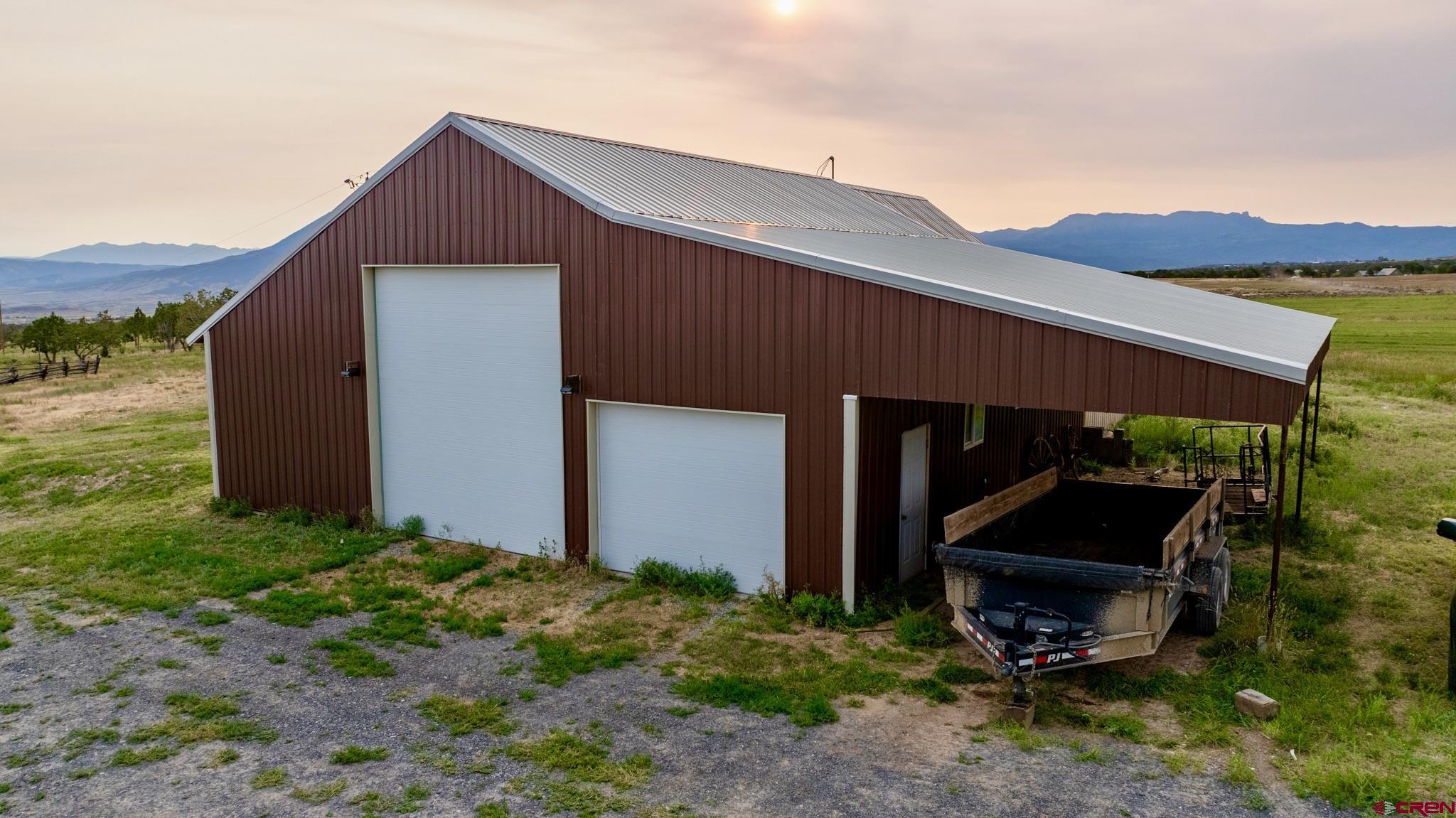 1253 3350th Road Crawford, CO 81415 - Photo 34 of 41 a front view of a house with garden