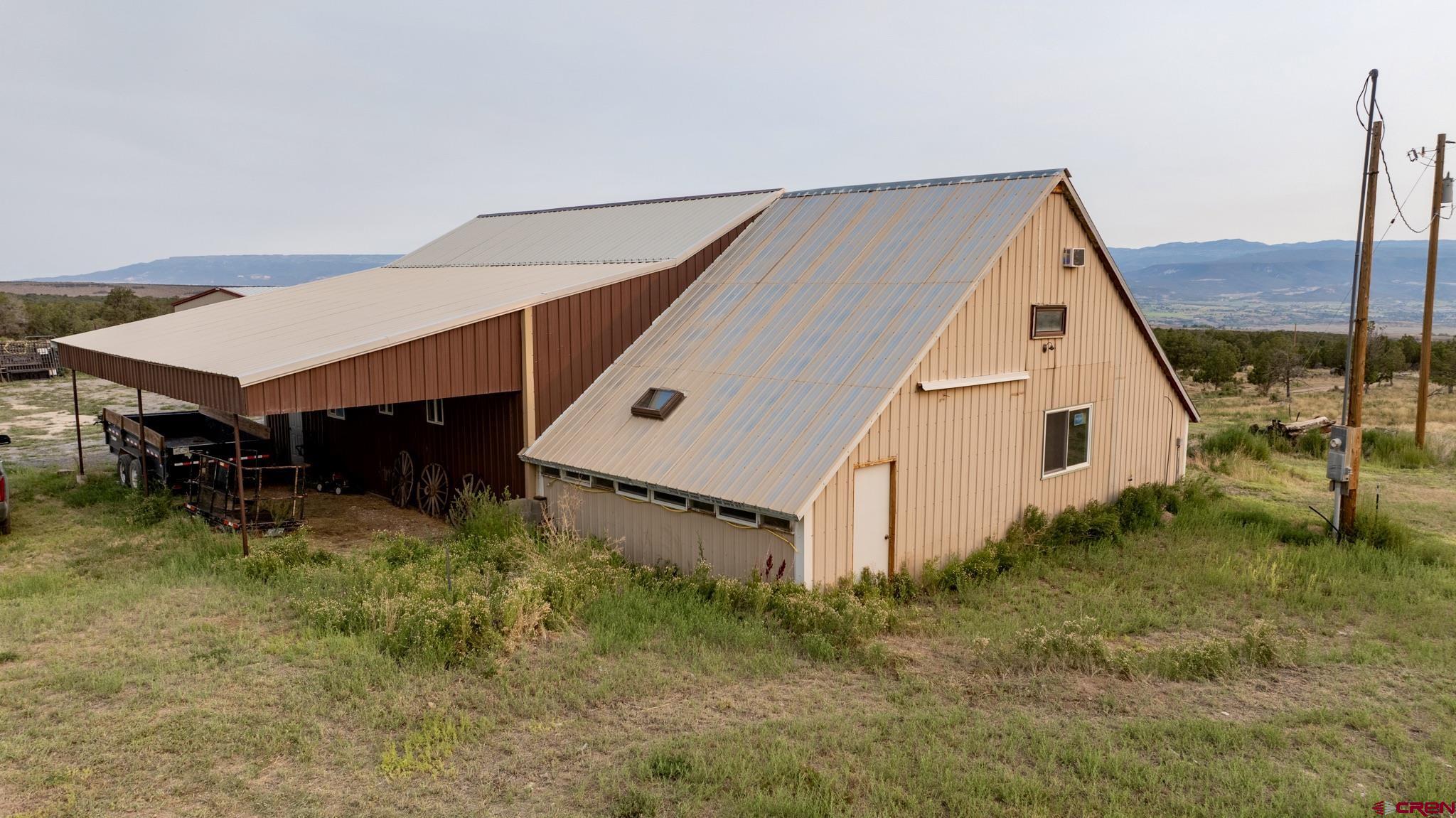 1253 3350th Road Crawford, CO 81415 - Photo 35 of 41 a view of a house with a yard