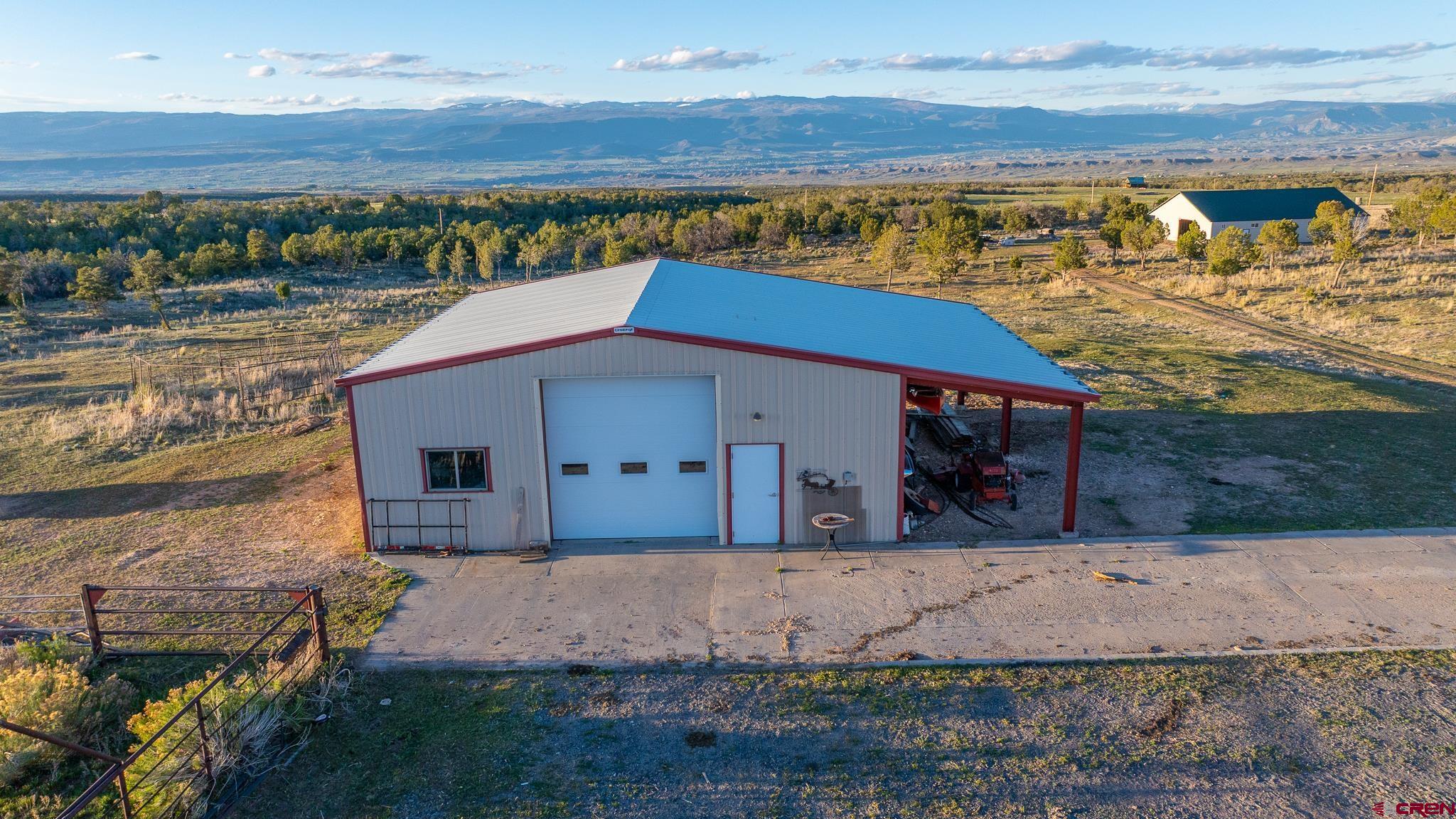1253 3350th Road Crawford, CO 81415 - Photo 35 of 41 a aerial view of a house with a yard