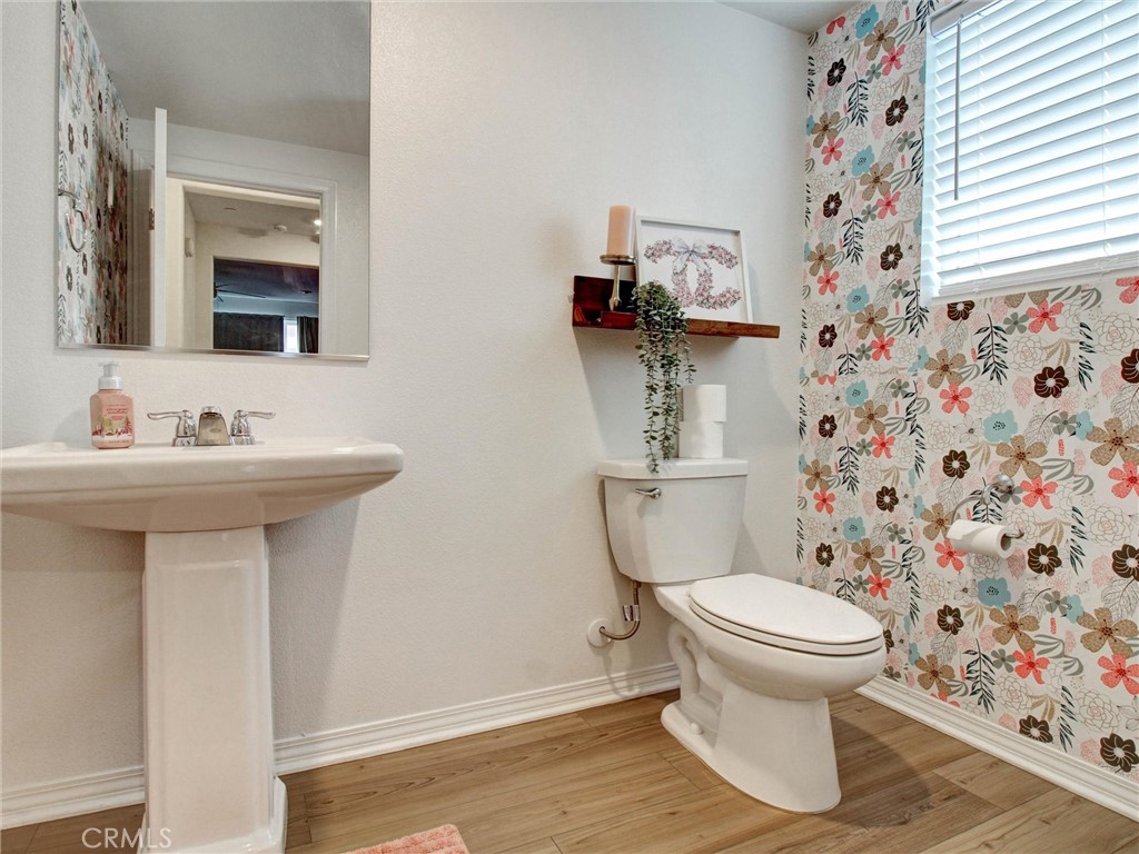 2497 Gunner Ridge Way Rialto, CA 92377 - Photo 14 of 49 a bathroom with a sink and a mirror