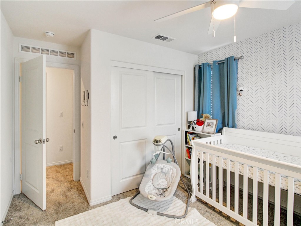 2497 Gunner Ridge Way Rialto, CA 92377 - Photo 33 of 49 a bedroom with furniture and a window