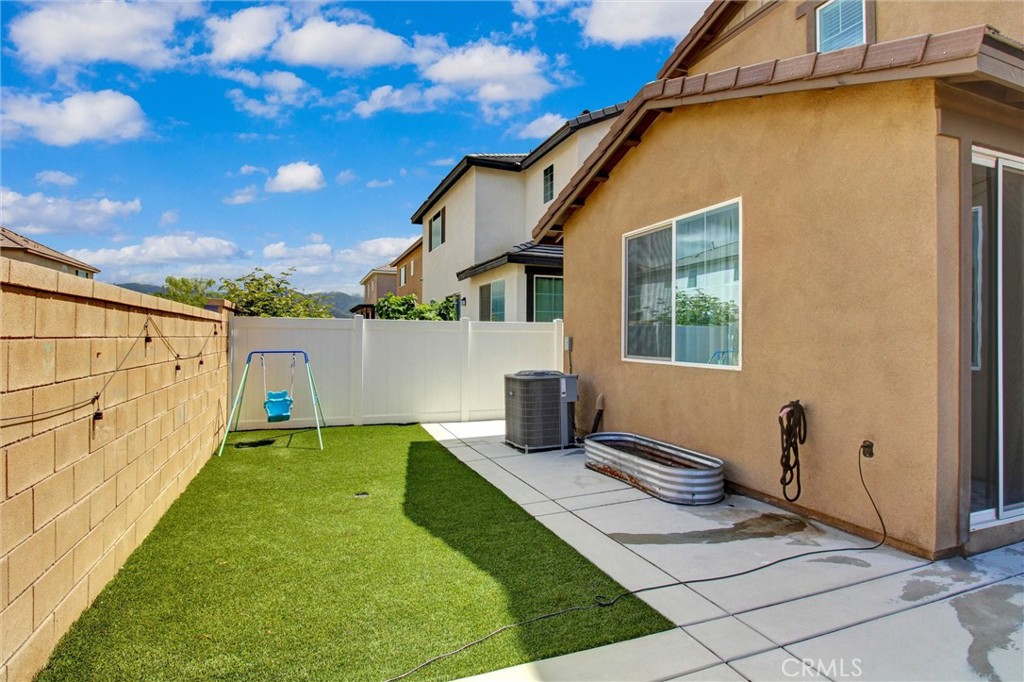 2497 Gunner Ridge Way Rialto, CA 92377 - Photo 40 of 49 a view of a house with backyard