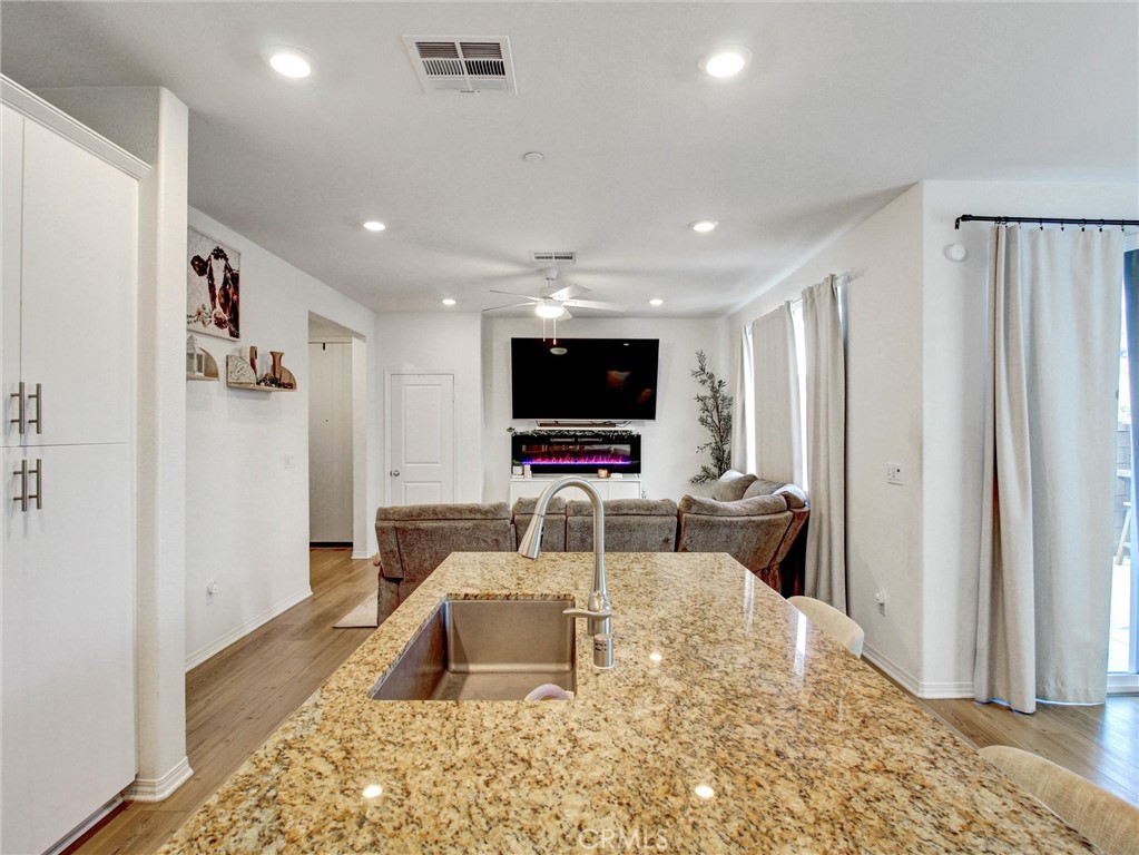 2497 Gunner Ridge Way Rialto, CA 92377 - Photo 7 of 49 a room with furniture and a flat screen tv