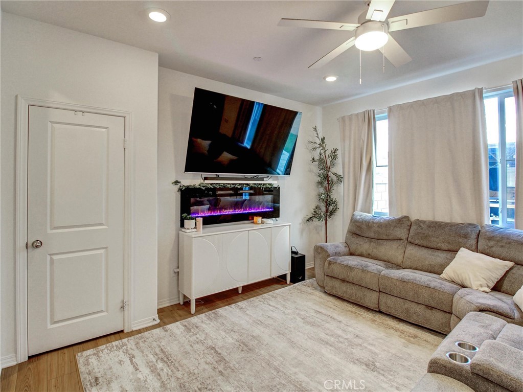 2497 Gunner Ridge Way Rialto, CA 92377 - Photo 10 of 49 a living room with furniture and a flat screen tv