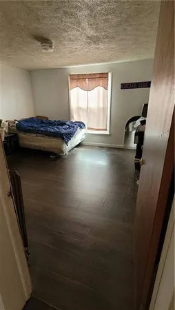 a view of a hardwood floor and a window