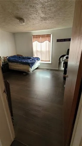 a view of a hardwood floor and a window