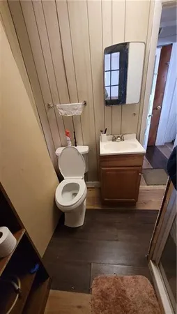 a bathroom with a toilet and a sink