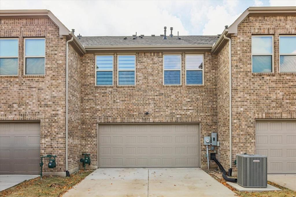 6072 Silverado Trail McKinney, TX 75070 - Photo 19 of 24 front view of a brick house with a door
