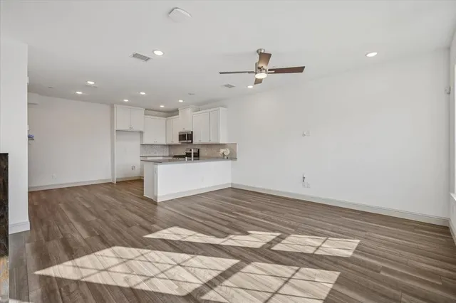 a view of a kitchen with a sink and cabinets