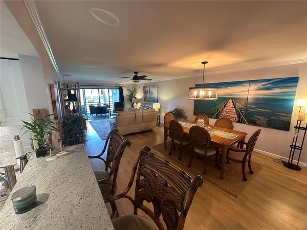 a view of a dining room with furniture window and wooden floor
