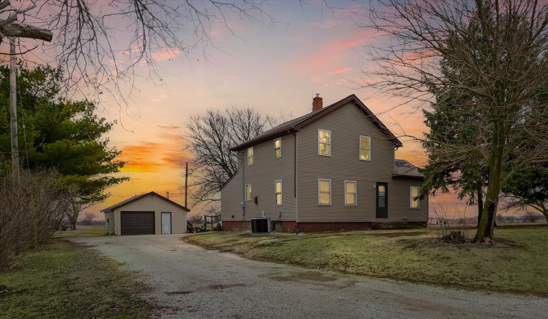 314 North 200 East Road Loda, IL 60948 - Photo 1 of 28 a front view of a house with a yard and garage