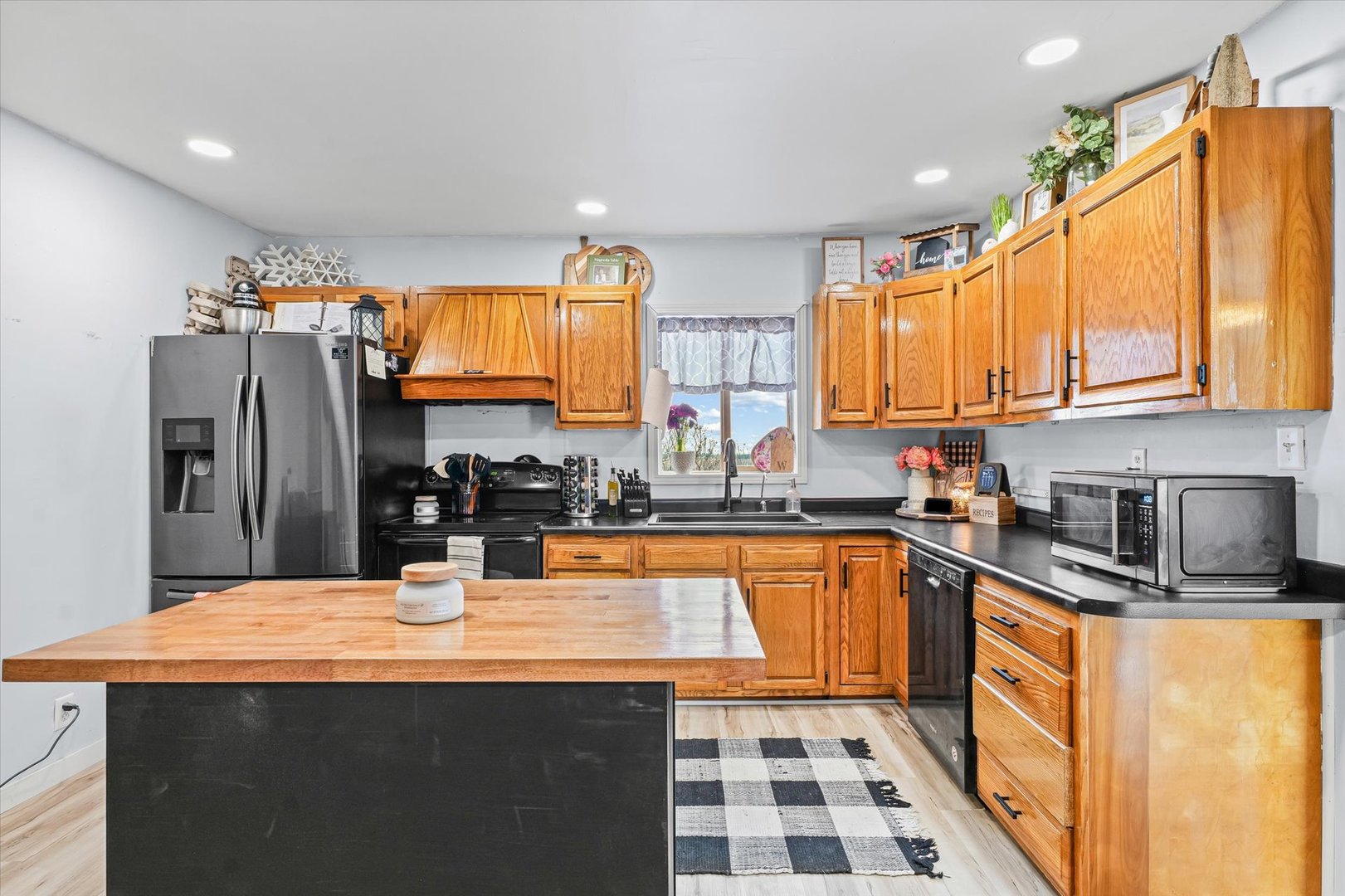 314 North 200 East Road Loda, IL 60948 - Photo 12 of 28 a kitchen with stainless steel appliances a sink stove and refrigerator