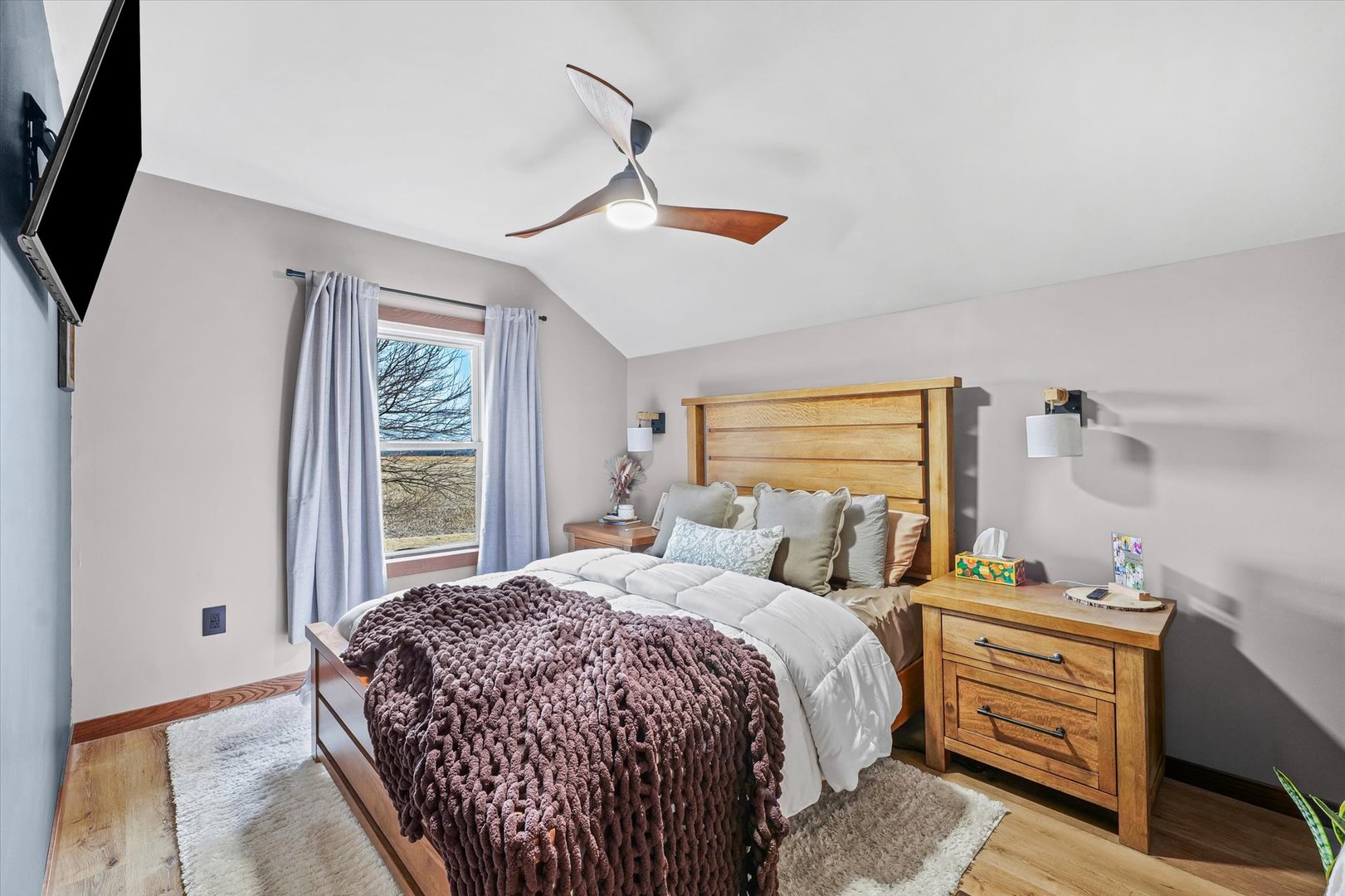 314 North 200 East Road Loda, IL 60948 - Photo 17 of 28 a bedroom with a bed a flat screen tv and next to a window