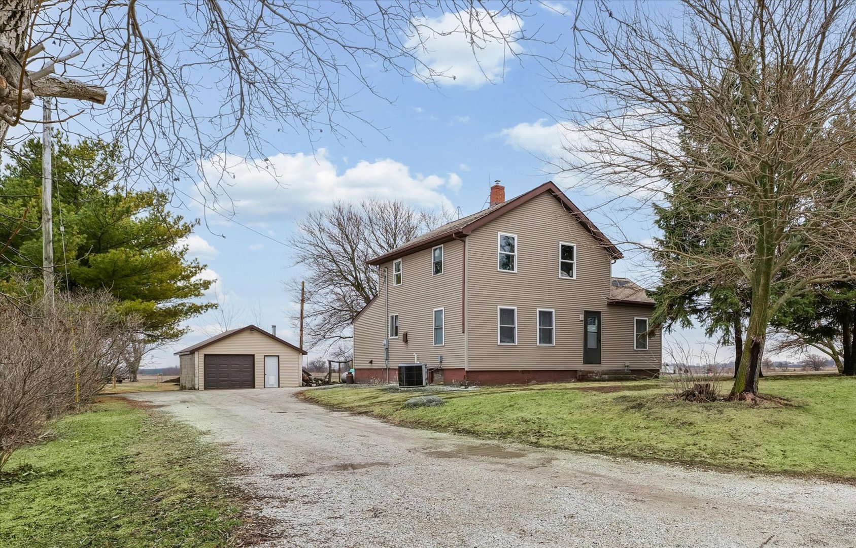 314 North 200 East Road Loda, IL 60948 - Photo 2 of 28 a view of a yard in front of a house with large trees