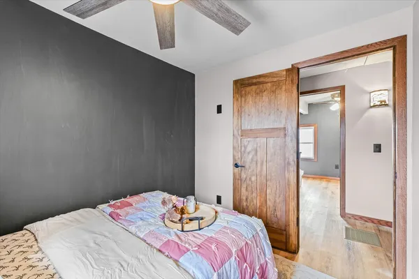 a bedroom with a bed and a table