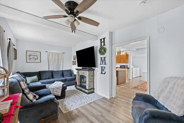 a living room with furniture and a flat screen tv