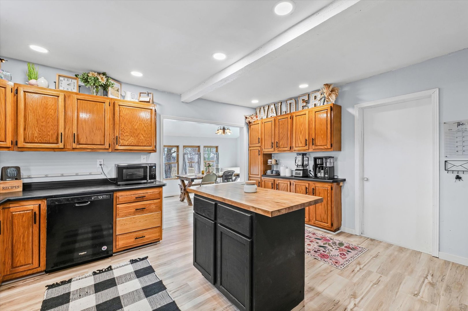 314 North 200 East Road Loda, IL 60948 - Photo 10 of 28 a kitchen with stainless steel appliances granite countertop a stove a sink dishwasher and a microwave oven with cabinets