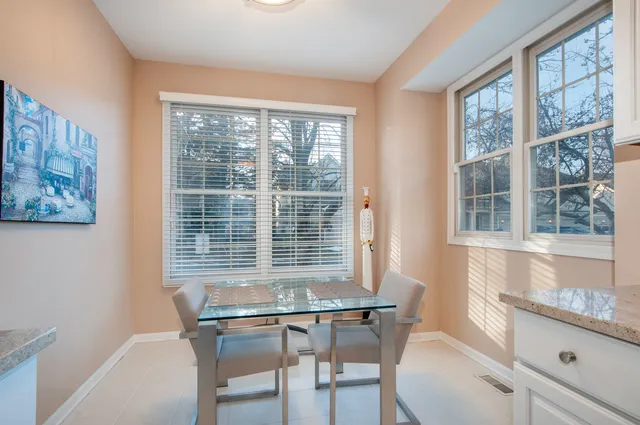 a view of a room that has a table and chair
