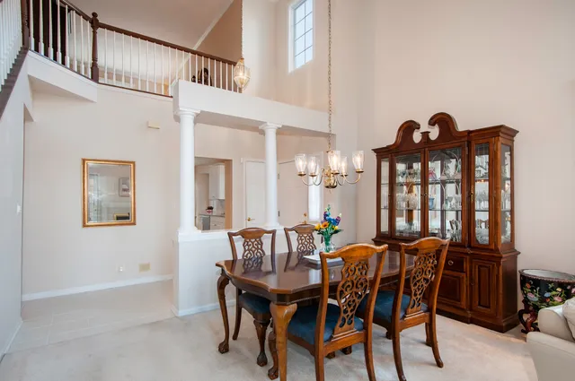 a view of a dining room with furniture and window