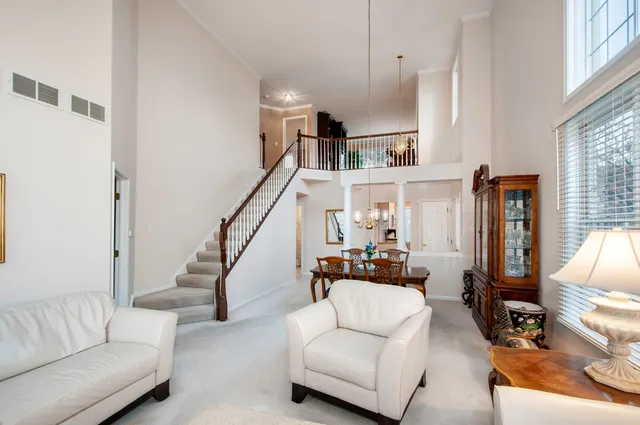 a living room with furniture or stairs and a couch