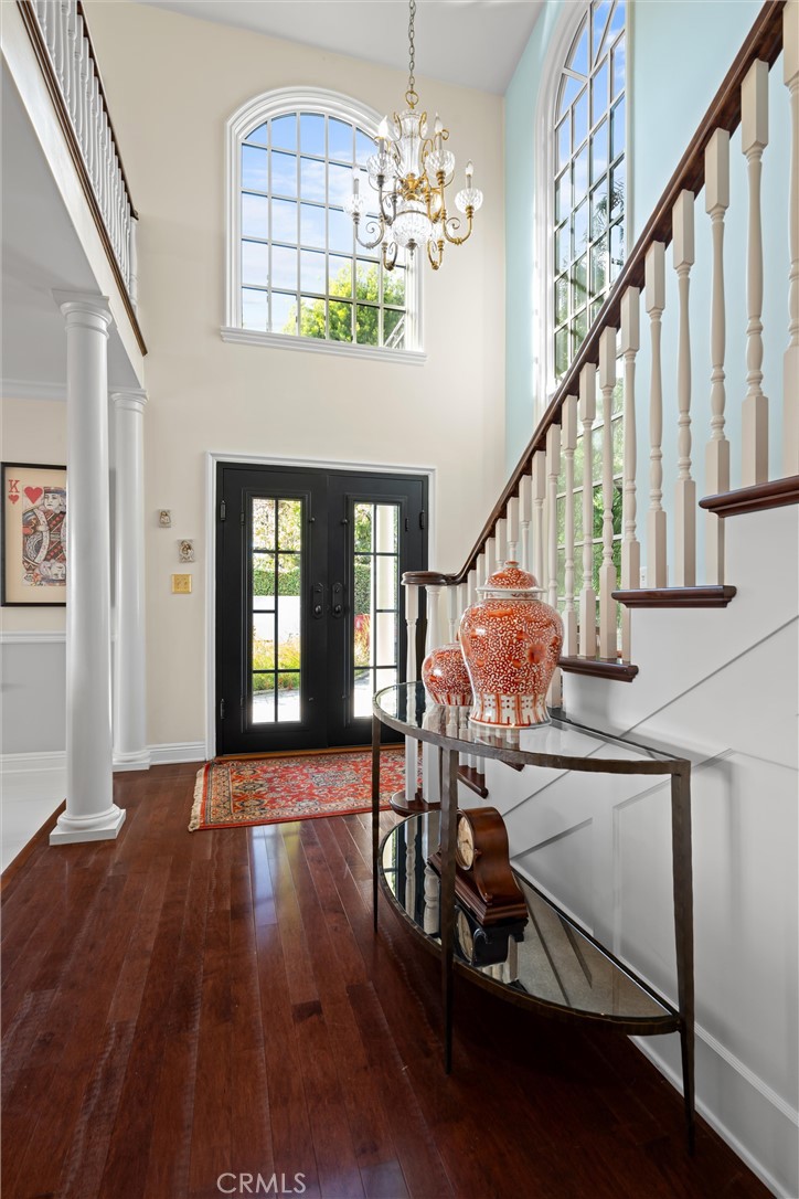 913 Sherlock Drive Burbank, CA 91501 - Photo 13 of 53 a dining room with wooden floor chandelier entryway and windows