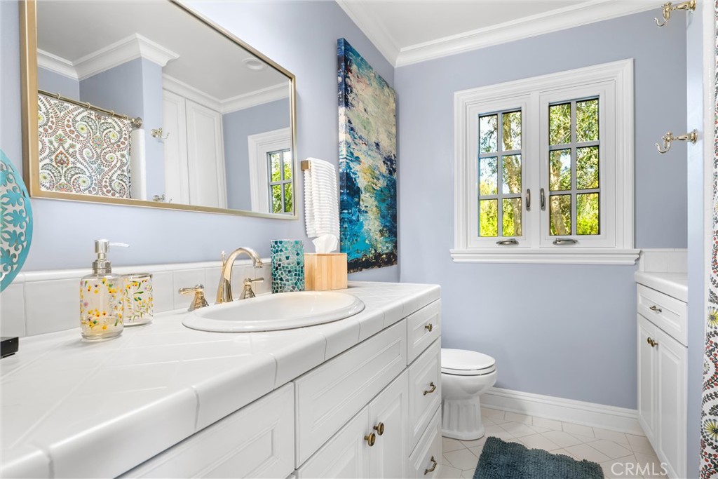 913 Sherlock Drive Burbank, CA 91501 - Photo 26 of 53 a bathroom with a sink a toilet and a window